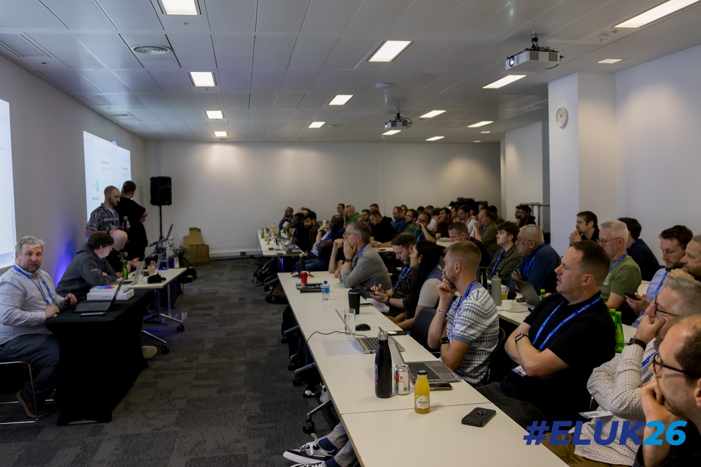 A full room at the Intune Academy workshop at Experts Live UK 2026 in London, with Dean Ellerby at the presenters' table on the left